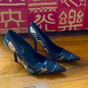 Black-and-White patterned heels with fringe & buckle detail at the toe.